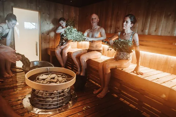Group of friends enjoying a traditional sauna together